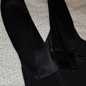 Cuffed one piece suit with low cut top